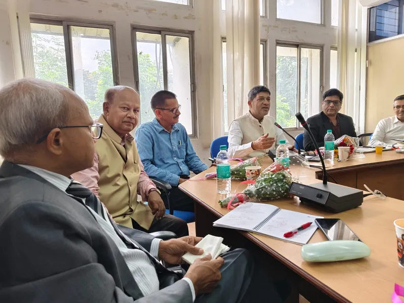 Members in discussion around a meeting table