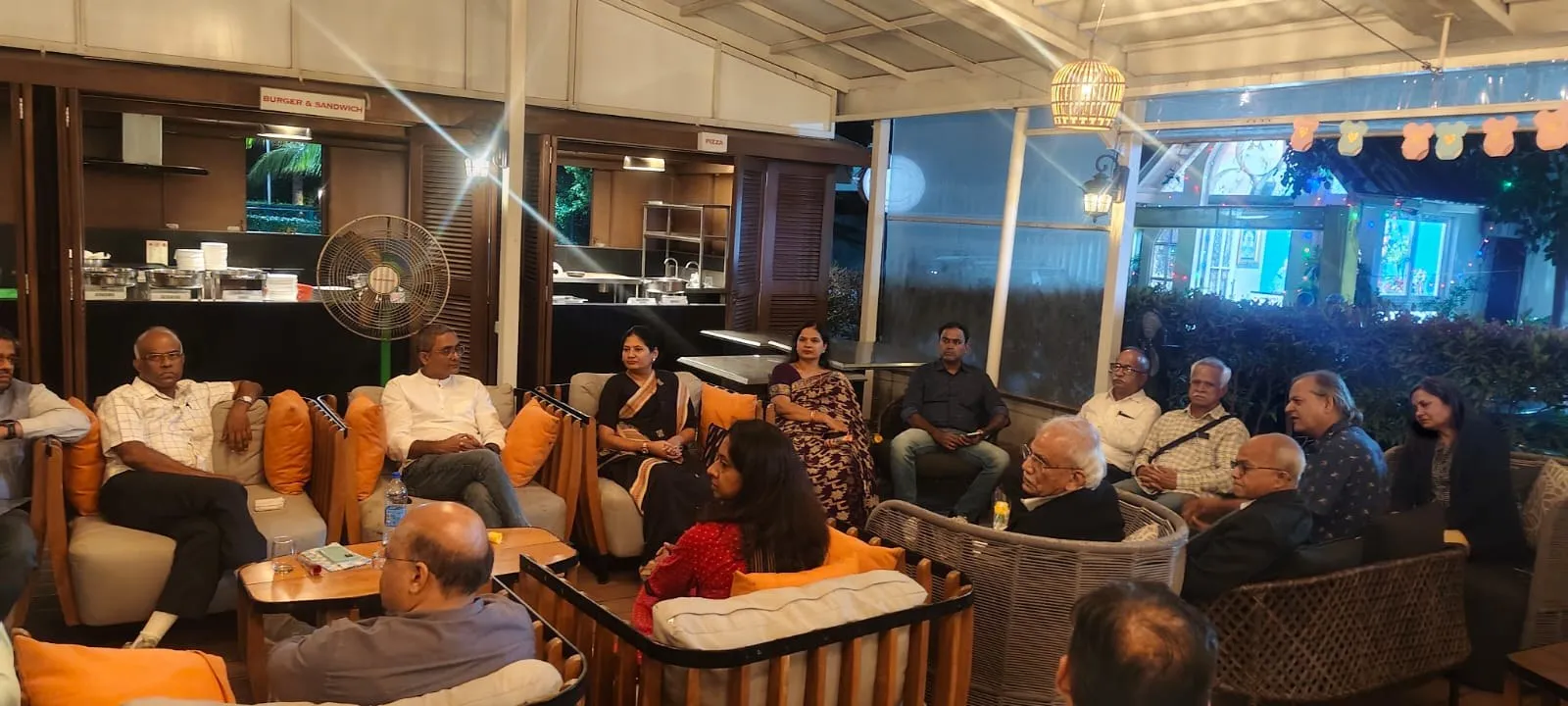 Members in conversation at an evening networking meet