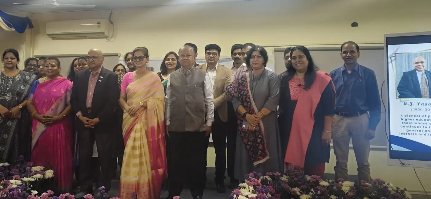 Group photo on stage at an International Women’s Day celebration