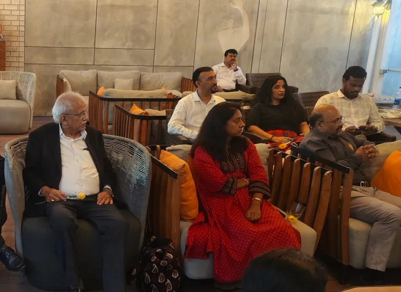 Members and guests seated at an evening meet