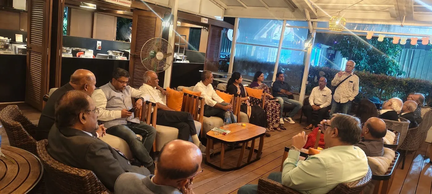 A wide view of members gathered at an evening meet